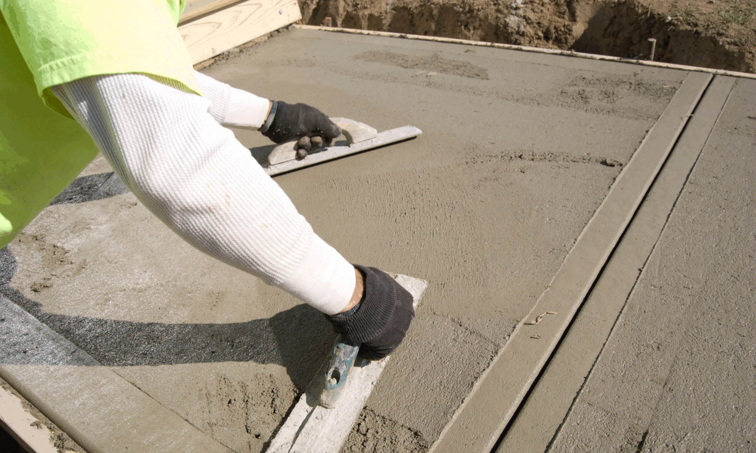 an image to show concrete manufacturers spreading the concrete